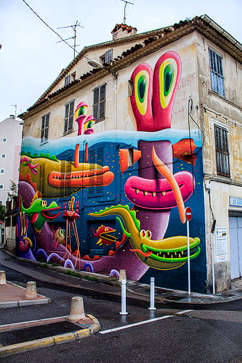 Colorful street art mural featuring monsters on a building wall in Antibes, France. HD phone wallpaper