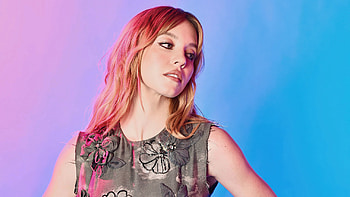 Redhead Sydney Sweeney Girl Model Is Standing In Light Purple Blue Background Wearing Black Dress Girls HD wallpaper