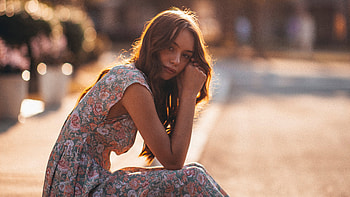 Woman In White And Brown Floral Dress Sitting On Gray Concrete Road During Daytime , dress, girls, model HD wallpaper