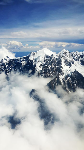 Stunning aerial view of snow-capped Andes mountains with clouds in La Paz, Bolivia. HD phone wallpaper