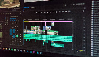 Close-up of a video editing timeline interface on a computer screen, showcasing professional software in action. HD wallpaper