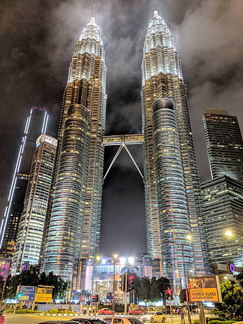 Petronas Twin Towers, Towering marvel, Cityscape centerpiece, Modern architecture HD phone wallpaper