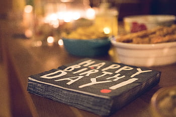 Close-up of a festive birtay table setup with snacks and decor. HD wallpaper