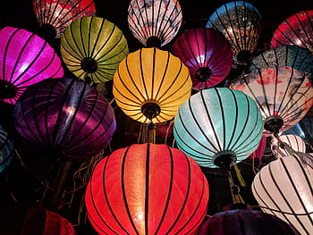 Colorful Chinese lanterns illuminating the night, perfect for festive celebrations. HD wallpaper