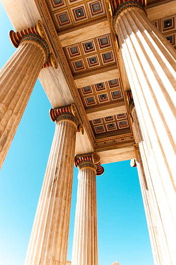 Explore ancient Greek architecture with a low angle view of grand columns in Athens. HD phone wallpaper