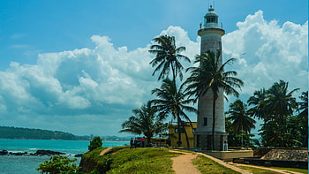 clouds over a lighthouse on a tropical point, lighthouse, tropical, bay, clouds, trees, pont HD wallpaper