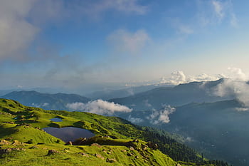 Stunning summer landscape of rolling green hills and misty mountains in Islamabad, Pakistan. HD wallpaper