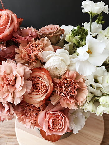 A romantic floral arrangement of roses and carnations in soft pastel tones, perfect for weddings or celebrations. HD phone wallpaper