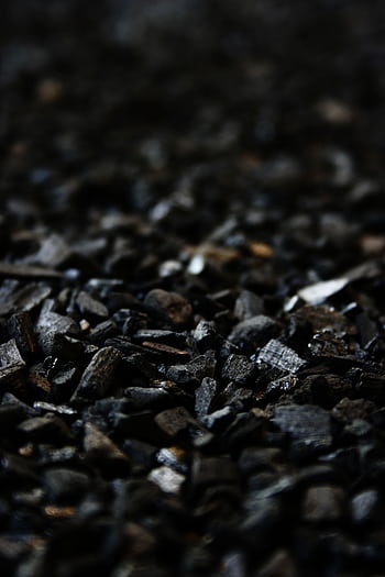 Detailed close-up of charcoal briquettes showing textures and shades. HD phone wallpaper