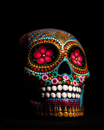 A vibrant and colorful sugar skull depicting Day of the Dead art with intricate designs on black background. HD phone wallpaper