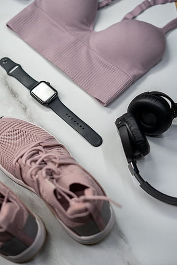 Flat lay of gym essentials with pink sportswear and smartwatch. HD phone wallpaper