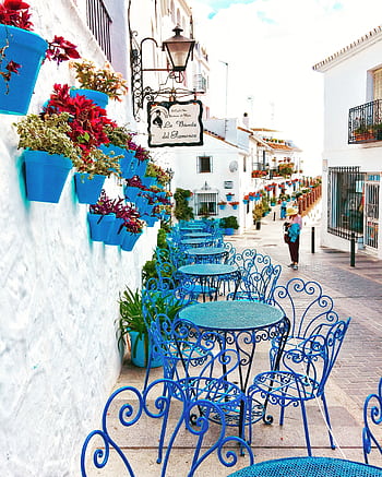 que outdoor café with vibrant blue chairs in Mijas, showcasing Andalusian charm. HD phone wallpaper