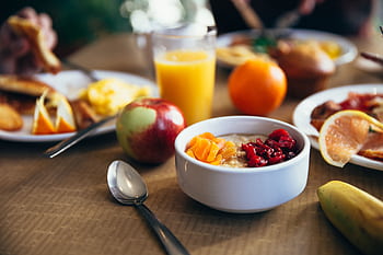 Delicious breakfast with fruits, oatmeal, and juice, ideal for a healthy start. HD wallpaper