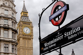 View of Big Ben and Westminster Station sign in London, England, capturing iconic British landmarks. HD wallpaper