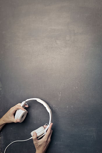 Hands placing modern white heads on dark chalkboard, top view. HD phone wallpaper