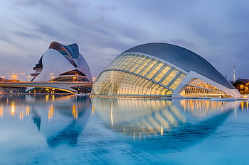 A breathtaking view of Valencia's City of Arts and Sciences reflected in serene waters at twilight. HD wallpaper