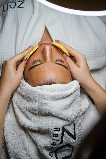 Relaxing spa treatment with facial and sponge massage in a serene environment. HD phone wallpaper