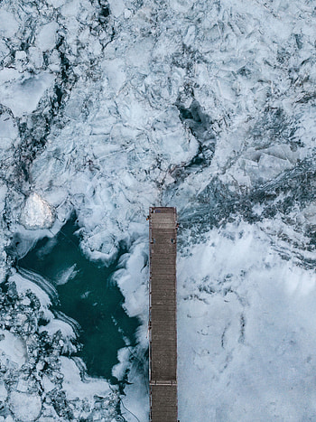 Frozen river, wooden dock, aerial view HD phone wallpaper