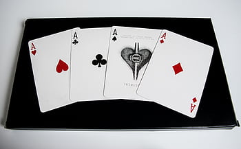 High-quality of four aces from a deck of playing cards on a black surface. HD wallpaper