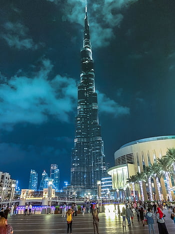 Stunning night view of Burj Khalifa, the tallest skyscraper in Dubai, illuminated against the sky. HD phone wallpaper