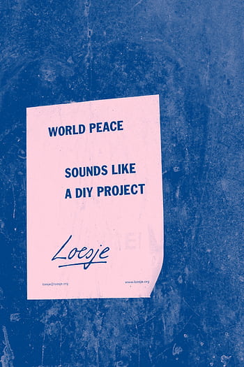 A motivational poster with a world peace quote on a textured blue wall background. HD phone wallpaper
