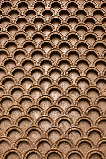 Intricate brown geometric pattern creating an abstract texture. HD phone wallpaper