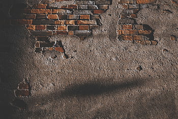 A vintage brick wall with exposed texture, ideal for background use. HD wallpaper