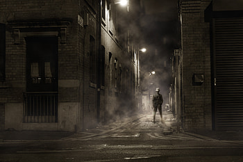 Man Wearing Black Suit Standing At The Center Of 2 Building, person, man, graphy, hat, smoke, monochrome, black-and-white HD wallpaper