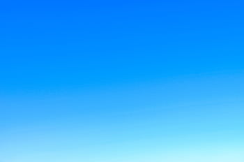 A serene view of a vibrant clear blue sky with a subtle gradient, perfect for backgrounds. HD wallpaper