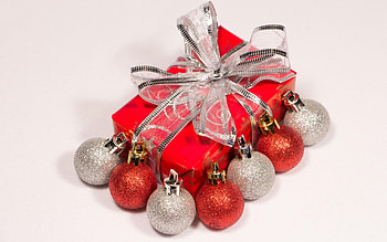 Red and silver baubles by the Christmas present HD wallpaper
