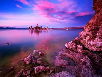 Purple colors of the sky, blue, sea, colorful, colors, peaceful, rocks, lake, purple, reflection, clouds, sky, ocean HD wallpaper