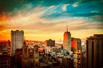 Stunning view of San Francisco cityscape with Golden Gate Bridge at sunset, vibrant urban atmosphere. HD wallpaper