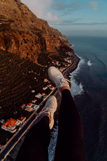 Mountains, City, View From Above, Coast, Miscellanea, Miscellaneous, Legs, Sneakers HD phone wallpaper