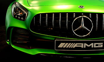 Close-up of a vibrant green Mercedes AMG grille showcasing the sleek design. HD wallpaper
