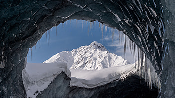 Glacier Cave Snow Covered Mountains In Blue Sky Background Nature HD wallpaper