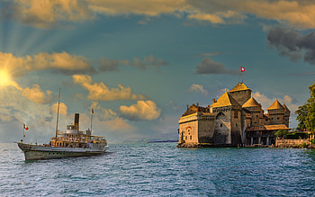Chillon Castle, Lake Geneva, evening, sunset, lake, Swiss flag, Chillon, Vaud, Switzerland HD wallpaper