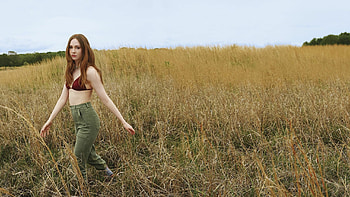 Blonde Karen Gillan Girl Model Is Walking In Grass Field Wearing Maroon And Green Color Pant Girls HD wallpaper