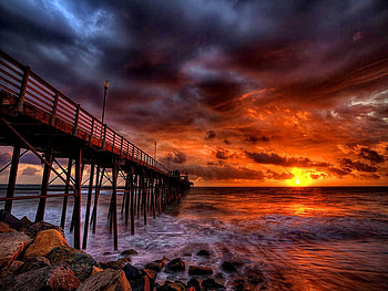 Perfect sunset, colorful, pier, perfect, nice, beach, waves, reflection, water, sunset, sea, sundown, sunburst, beautiful, stones, purple, red, clouds, nature, sky, lovely, evening HD wallpaper