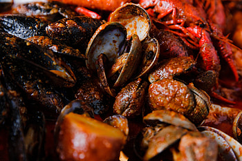 Crab delicacy, Vibrant claws, Seafood feast, Red-themed restaurant HD wallpaper