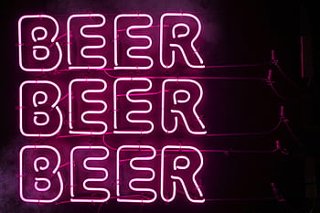 Bright pink neon sign displaying the word 'BEER' in Tokyo, Japan, at night. HD wallpaper