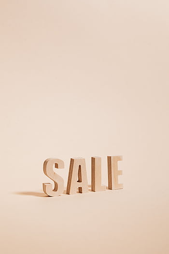 Wooden letters spelling SALE on a neutral beige background, perfect for promotions. HD phone wallpaper