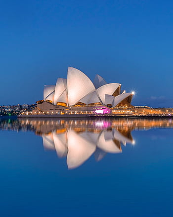Beautiful view of the Sydney Opera House and its reflection at dusk, highlighting iconic architecture. HD phone wallpaper