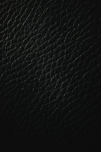 Close-up of a detailed black leather texture ideal for use as a background or pattern. HD phone wallpaper