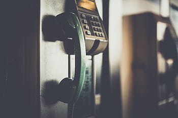 Close-up of a vintage green pay receiver with a nostalgic mood. HD wallpaper