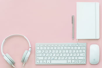Elegant flat lay of white electronics and stationery on pastel pink background. HD wallpaper
