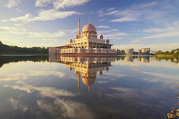 Beautiful scene of Putra Mosque reflecting on calm lake waters under a vibrant morning sky. HD wallpaper