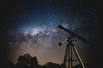 Stunning starry sky with silhouette of telescope capturing the Milky Way in Brazil. HD wallpaper