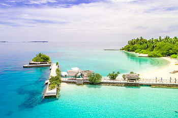 Discover paradise with this aerial view of a stunning turquoise beach in the Maldives. HD wallpaper