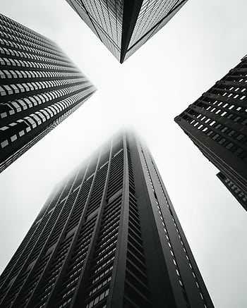 Dramatic low-angle shot of skyscrapers in Chicago creates a geometric urban scene. HD phone wallpaper