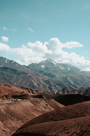 Breathtaking view of the rugged mountain landscape in Leh, India under a bright blue sky. HD phone wallpaper